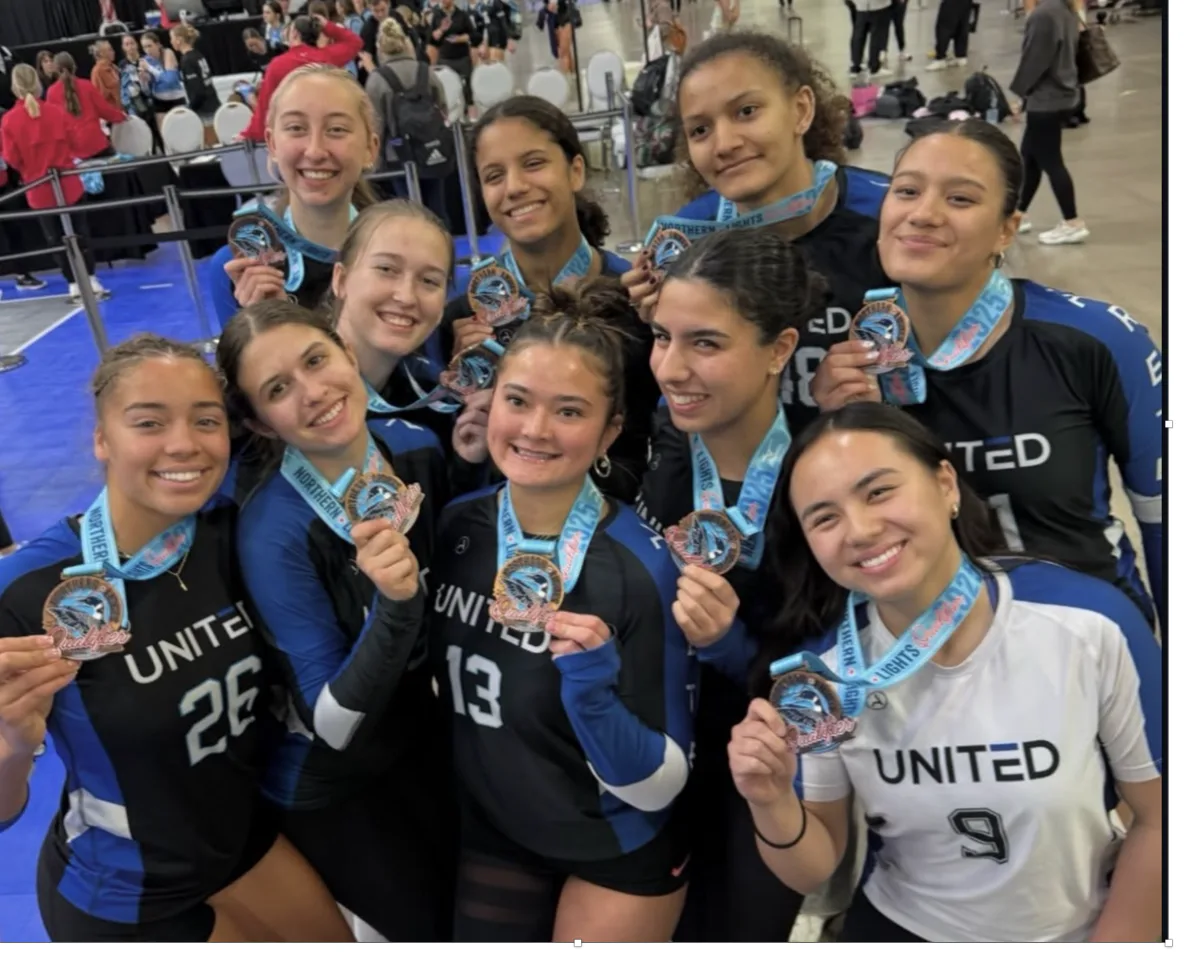 United Riverside club team celebrating with medals at the Northern Lights Qualifier